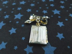 locket bow brooch bk